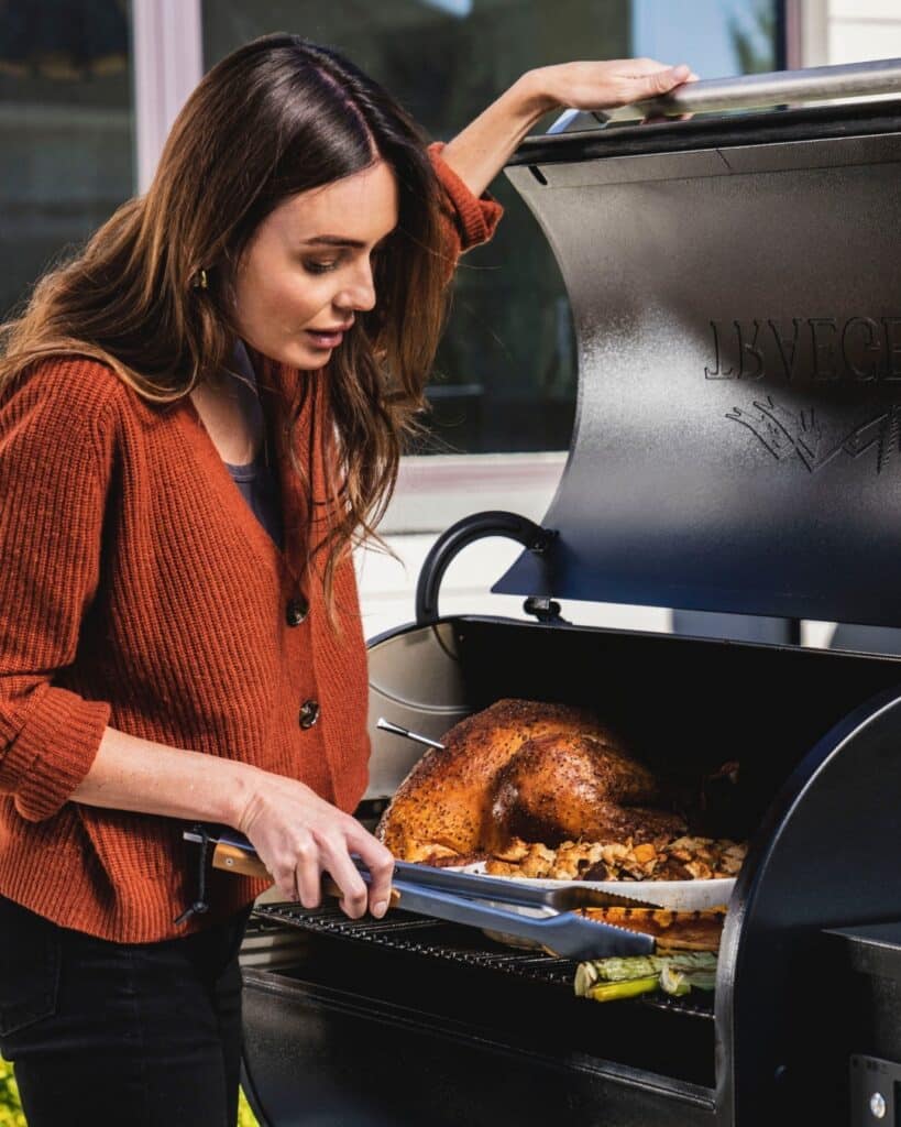 Woman Grilling With Traeger Grill