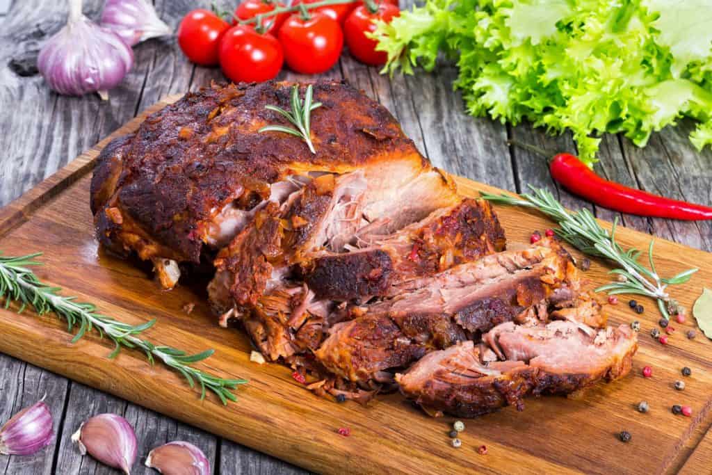 big piece of slow cooked oven barbecued pulled pork shoulder