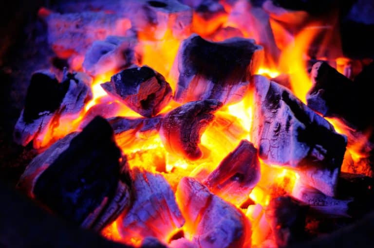 How To Use Wood Pellets in a Charcoal Grill Holy Smoke