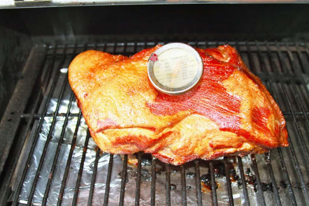 pork shoulder on a barbeque grill