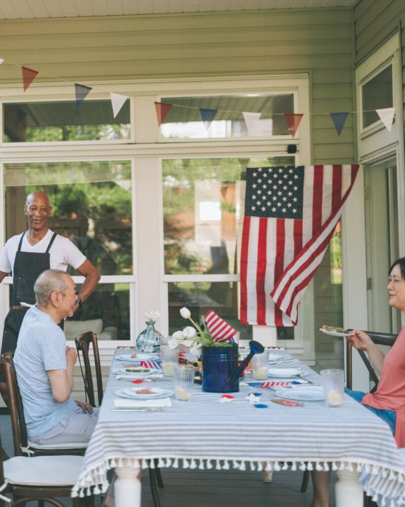 Family Grilling and Eating Food Outdoors
