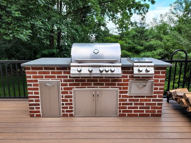 brick with wood accents outdoor kitchen