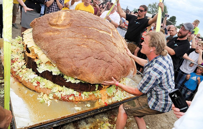 Curious People Watching The Biggest Burger Ever
