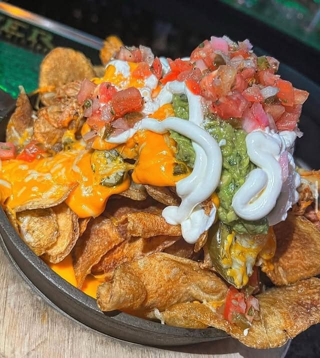 loaded nachos on a platter