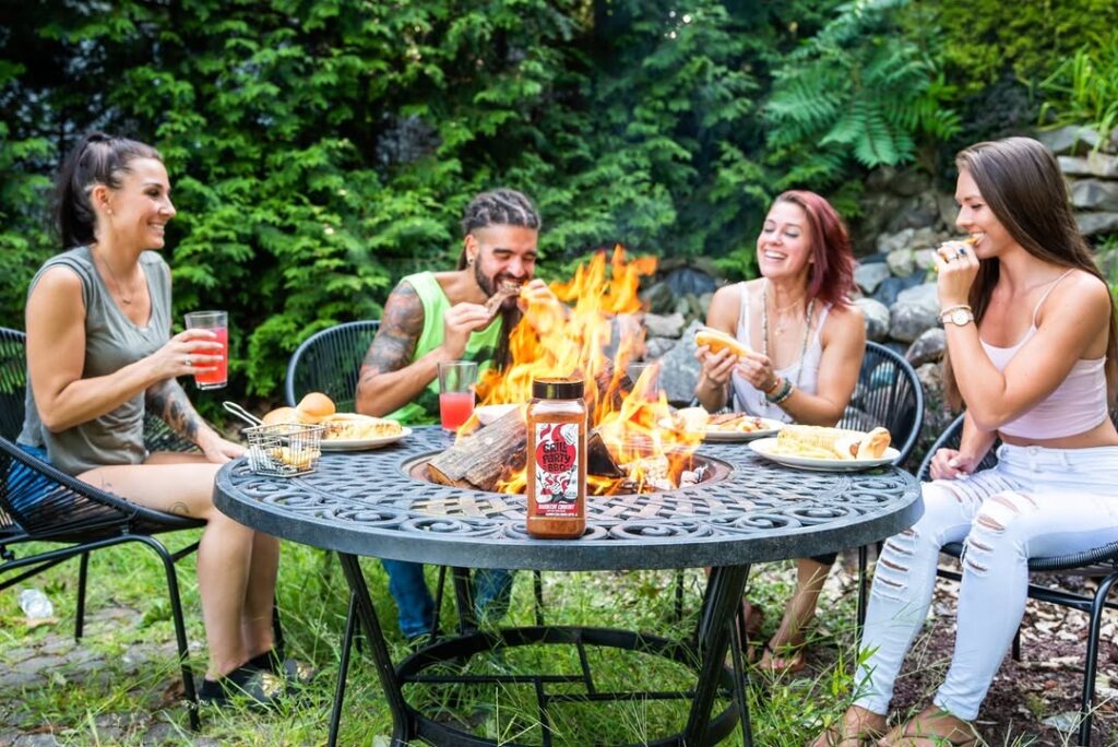 People Enjoying A Bbq Cookout