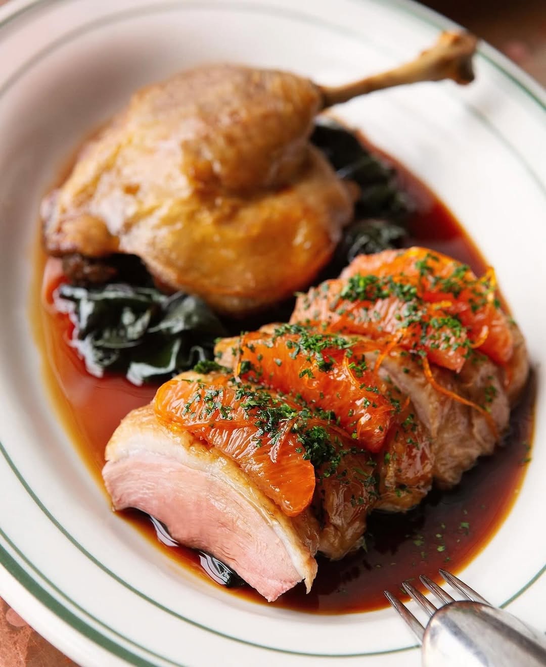 roasted duck à l’orange, served with a rich yet citrusy sauce