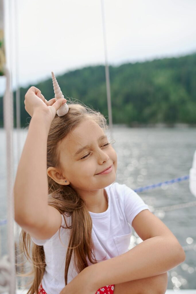 Grills Ahoy! Your Yacht Grilling Guide 3 A Child Enjoying The Sun On A Yacht