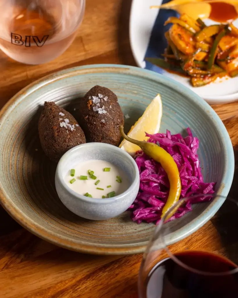 Grilled Cauliflower Wedges With Herb Tarator 1 Broccoli And Fresh Herb Falafel Served With Lemon And Chive Tarator