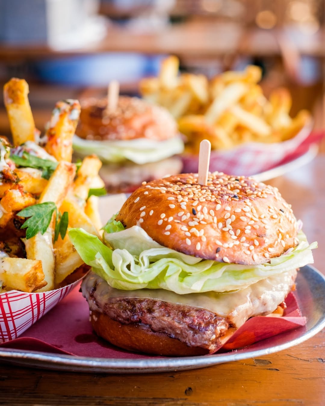 hamburgers and fries with veggies