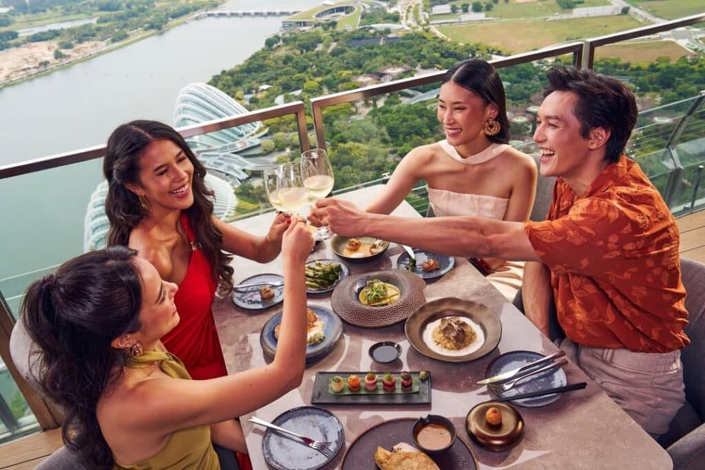 How To Make Hainanese Chicken Rice And Chili Crab At Home 3 High Rise Restaurant Balcony With People Dining