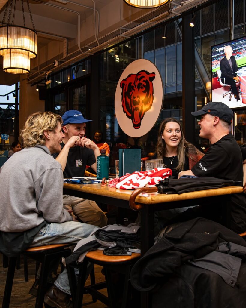 The Triangle Of Nirvana: How Bbq And Football Help Men’s Mental Health 4 Men Drinking Beer While Watching Football