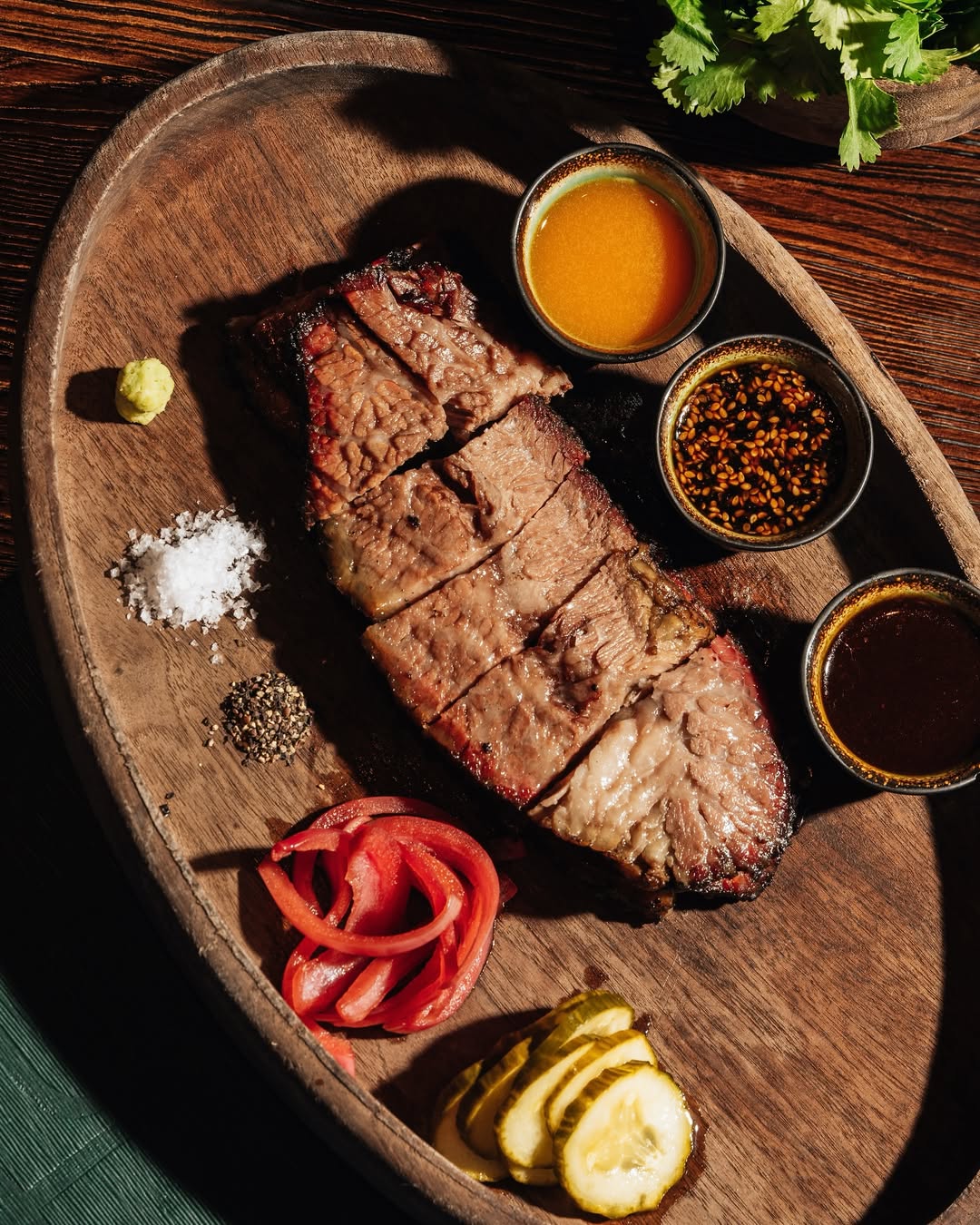 smoked beef brisket with sauces and sides