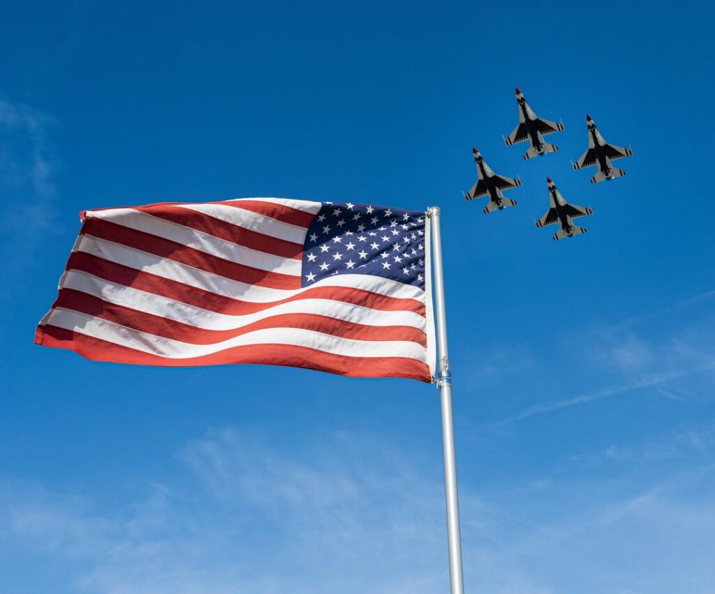 The American Flag With Four Fighter Jets In The Sky