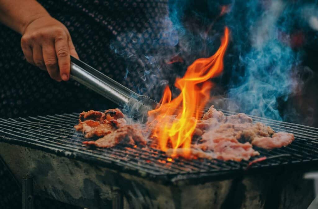 How To Organize A Backyard Bbq Fundraiser Or Block Party 1 Flames Over A Grill