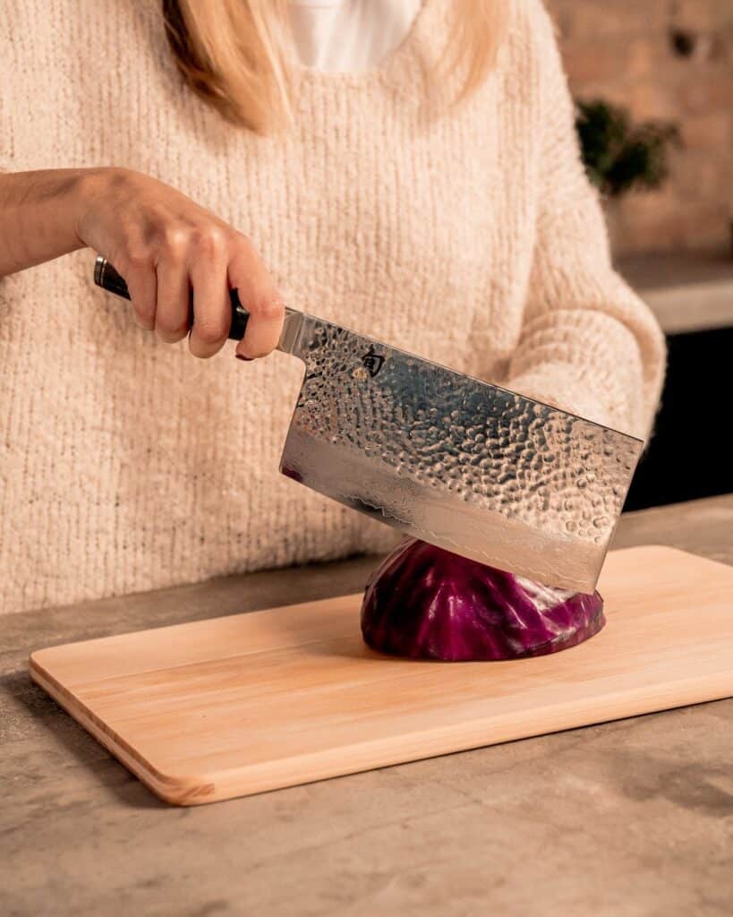 Inside The Shun Classic Bbq Knife Set: What Each Knife Does And When To Use It 6 Woman Chopping Onion With Large Shun Knife