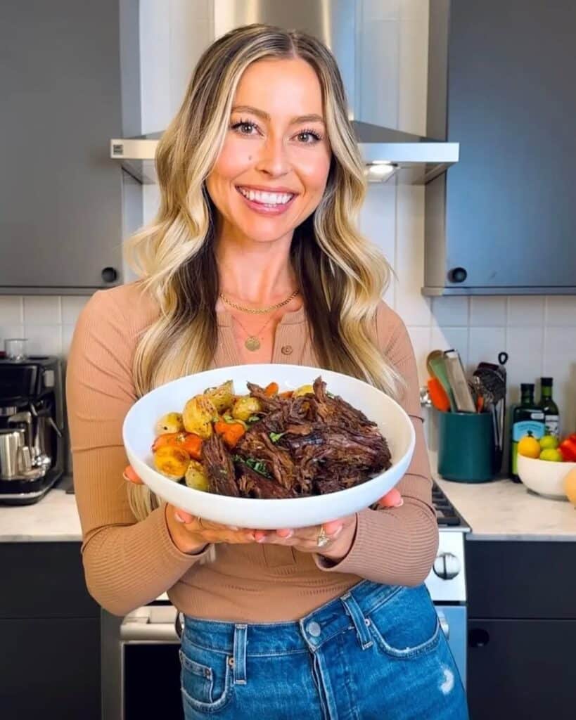 Woman Holding A Plate Of Reheated Leftover Chuck Roast