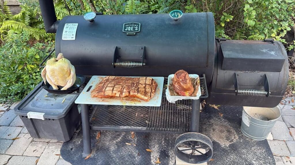 A Smoker Grill With Smoked Food On It