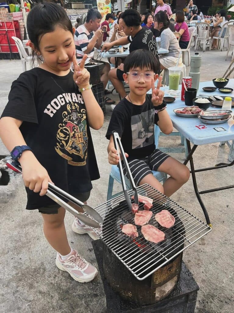 Children Learning How To Grill