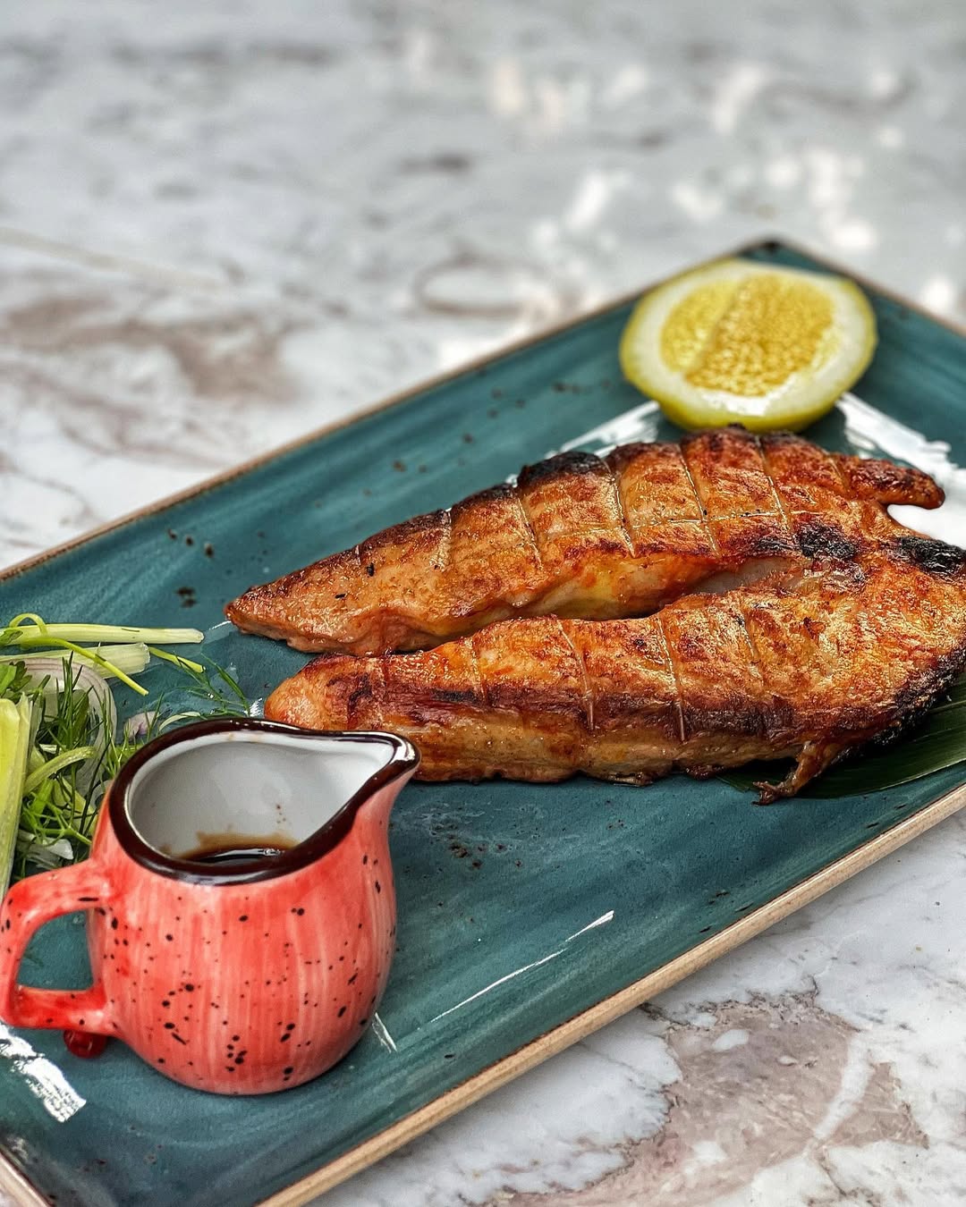 mediterranean-style grilled sturgeon with sea grapes