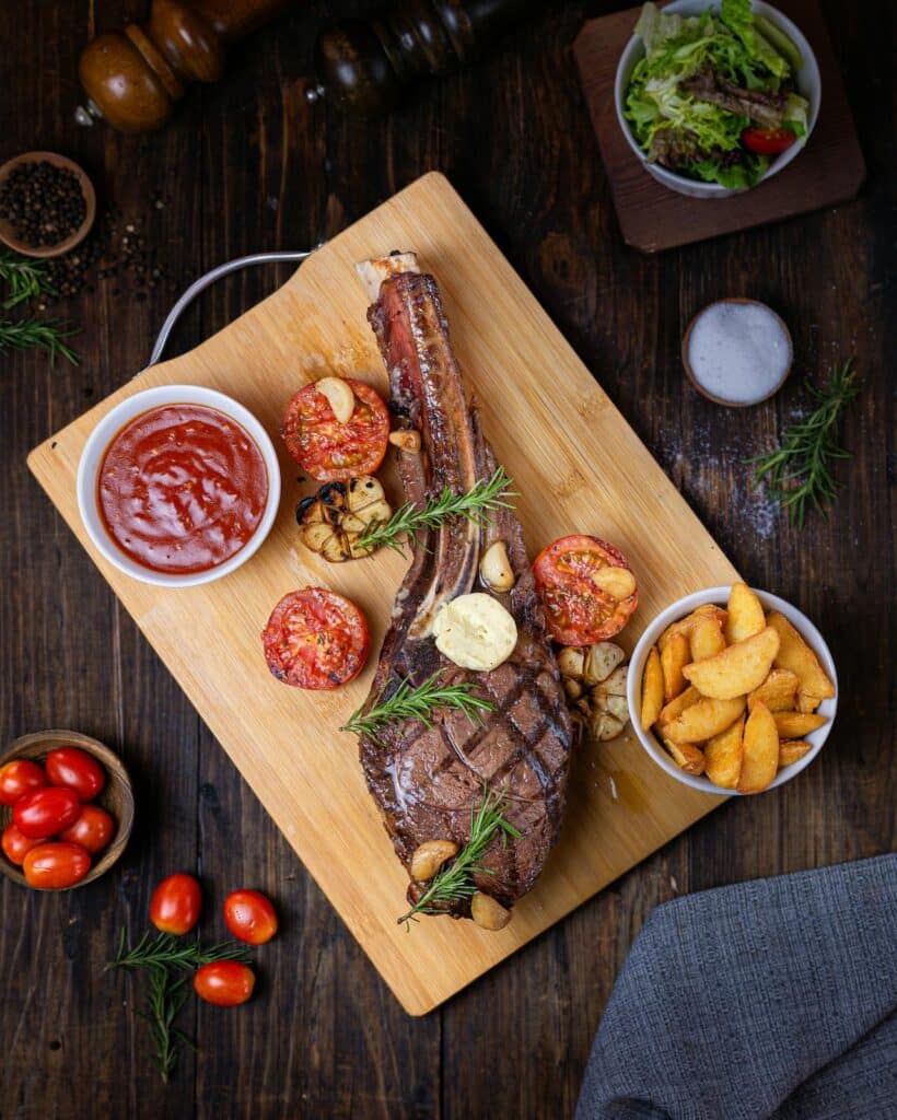 Omahawk Steak With Potatoes And Sauce