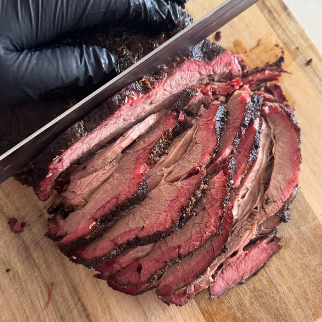 Pitmaster Cutting Smoked Meat