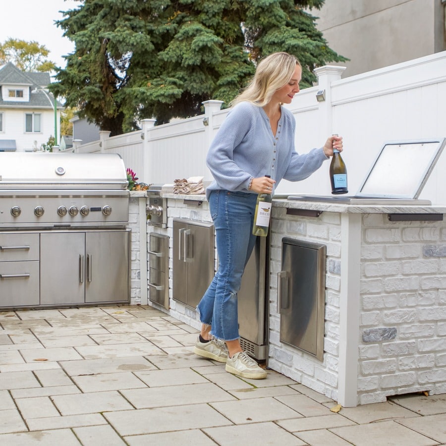 Backyard Bbq Layouts That Improve Workflow (Pitmaster Design Tips) 2 Woman Drinking Wine In Outdoor Kitchen