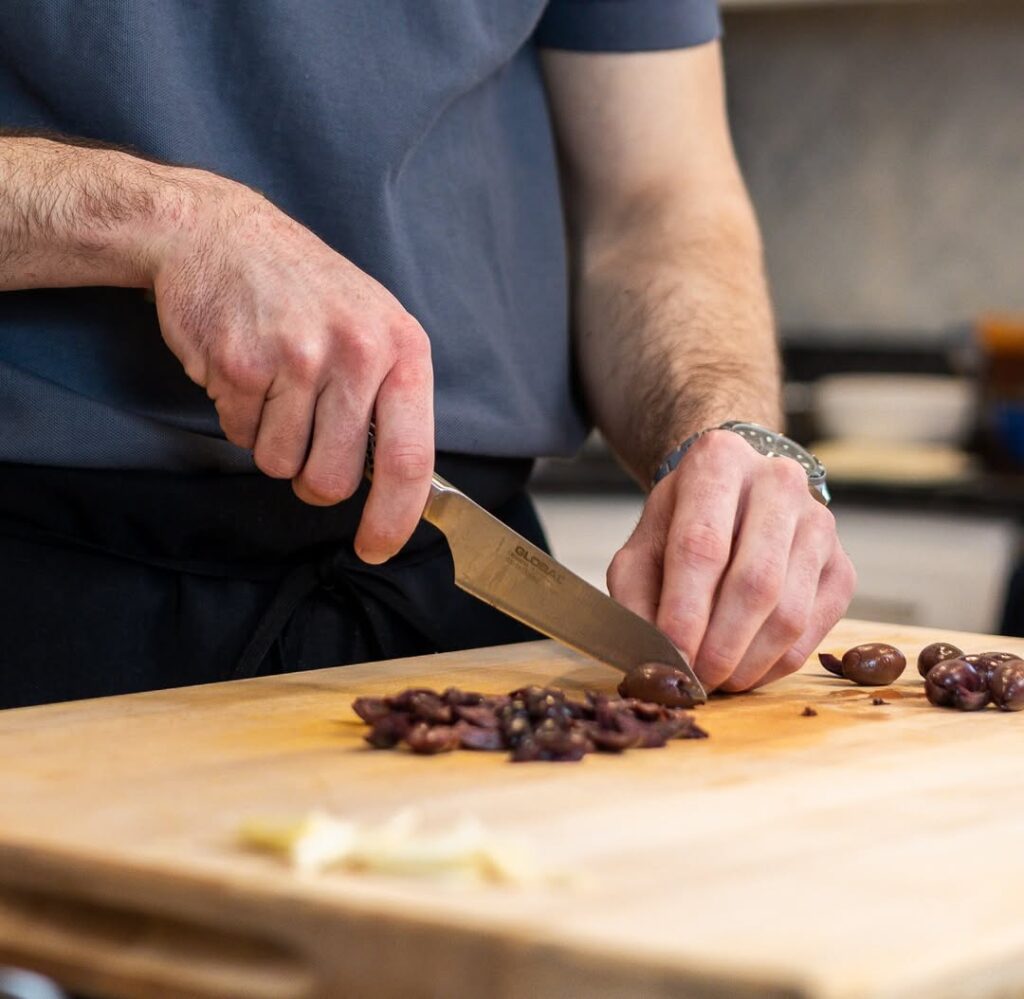Home Cook Chops Veggies With Paring Knife
