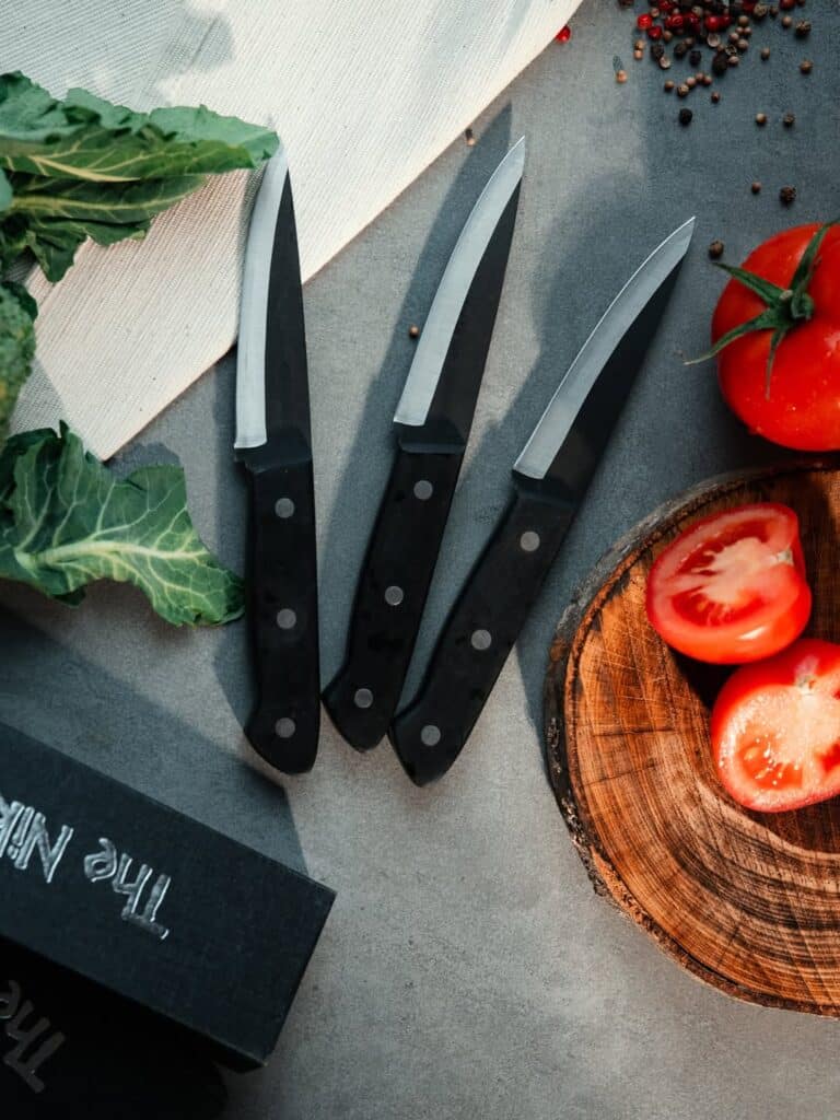Paring Knives On Chopping Board