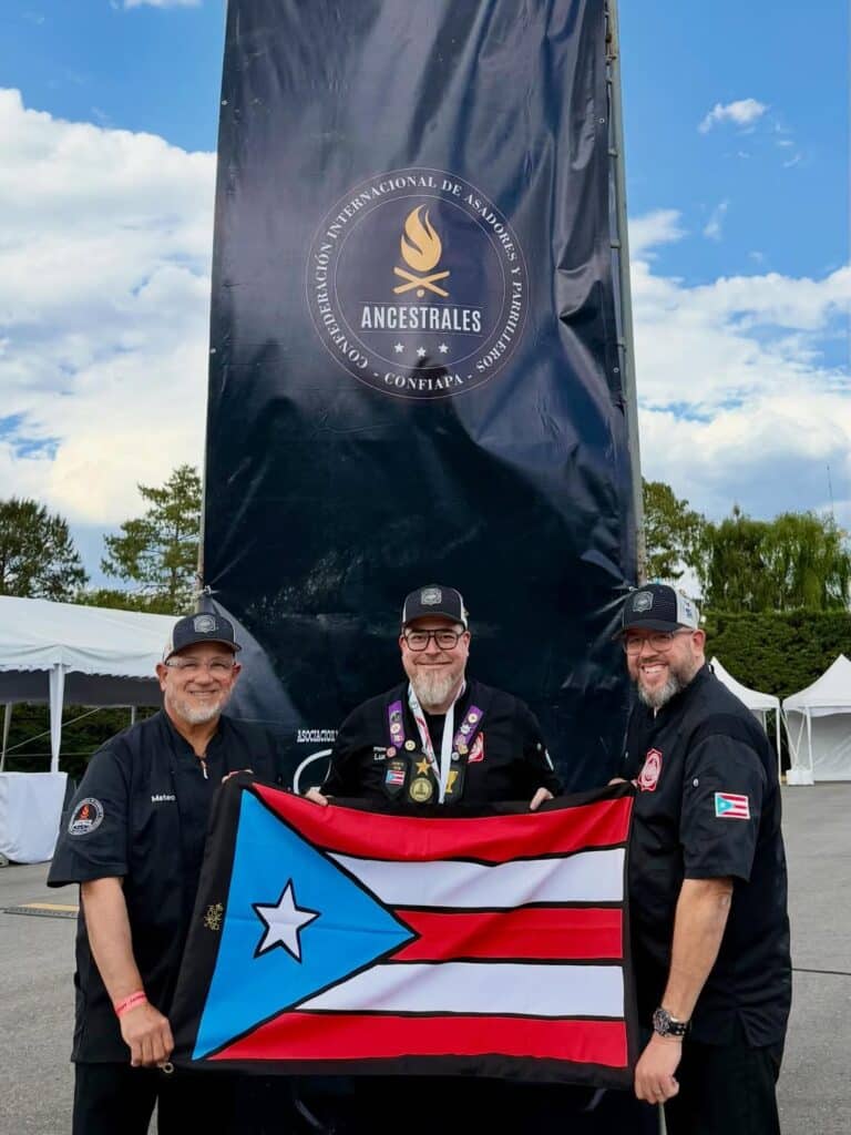 Three Pitmasters Pose For A Photograph