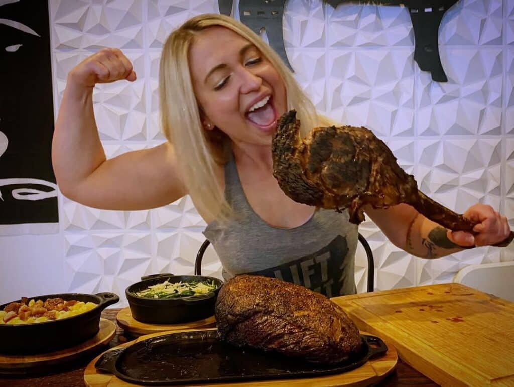 Woman Eating Wagyu Tomahawk Steak