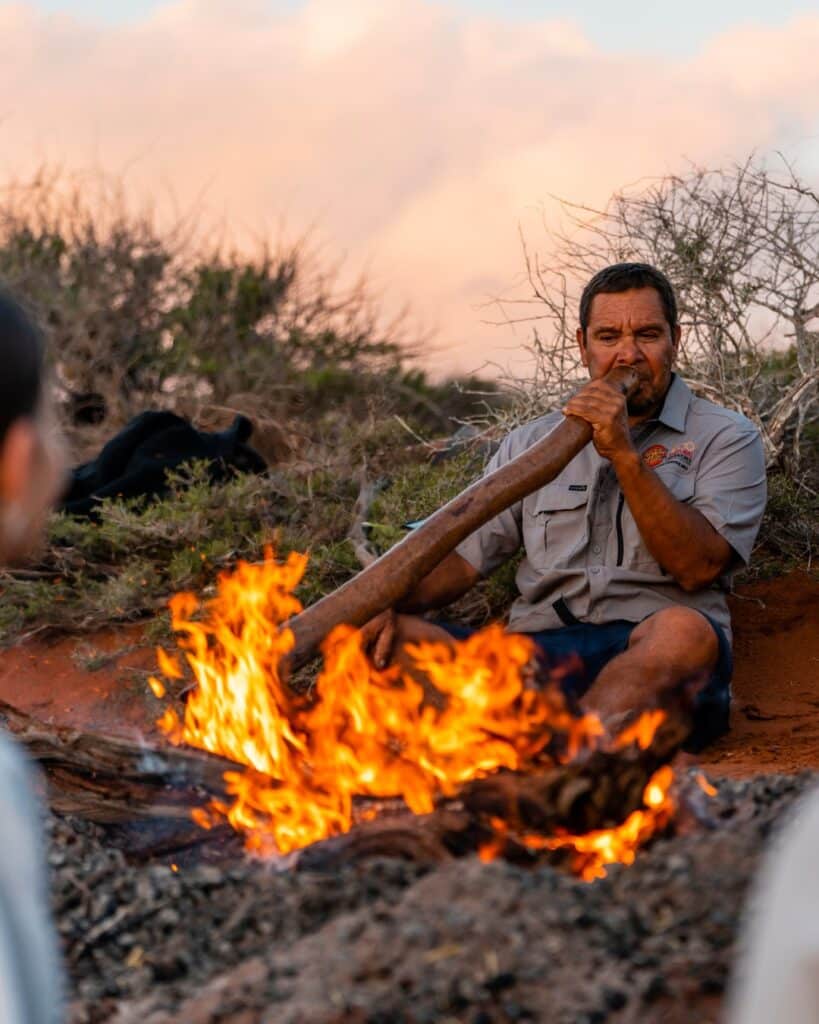 An Australian Aboriginal Man On Camp Fire