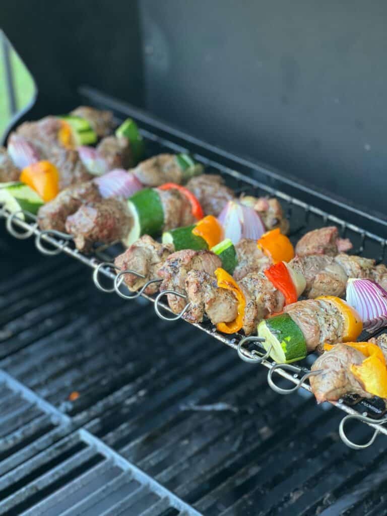 Kebabs And Fruit Skewers Being Grilled