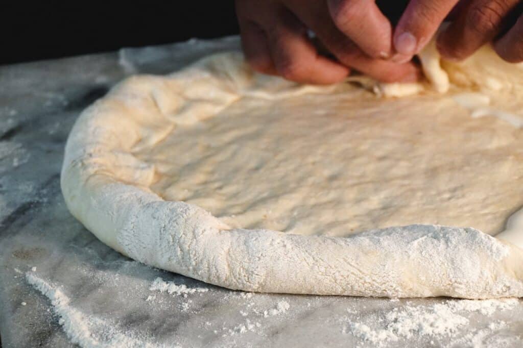 Pizza Dough Being Made For The Kiln