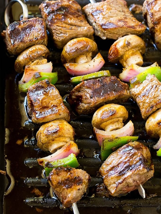 Steak Kabobs With Veggies On Skewers Being Grilled