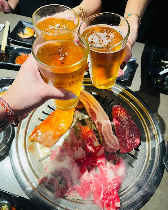 Friends Drink Beer While Their Bbq Is Being Cooked
