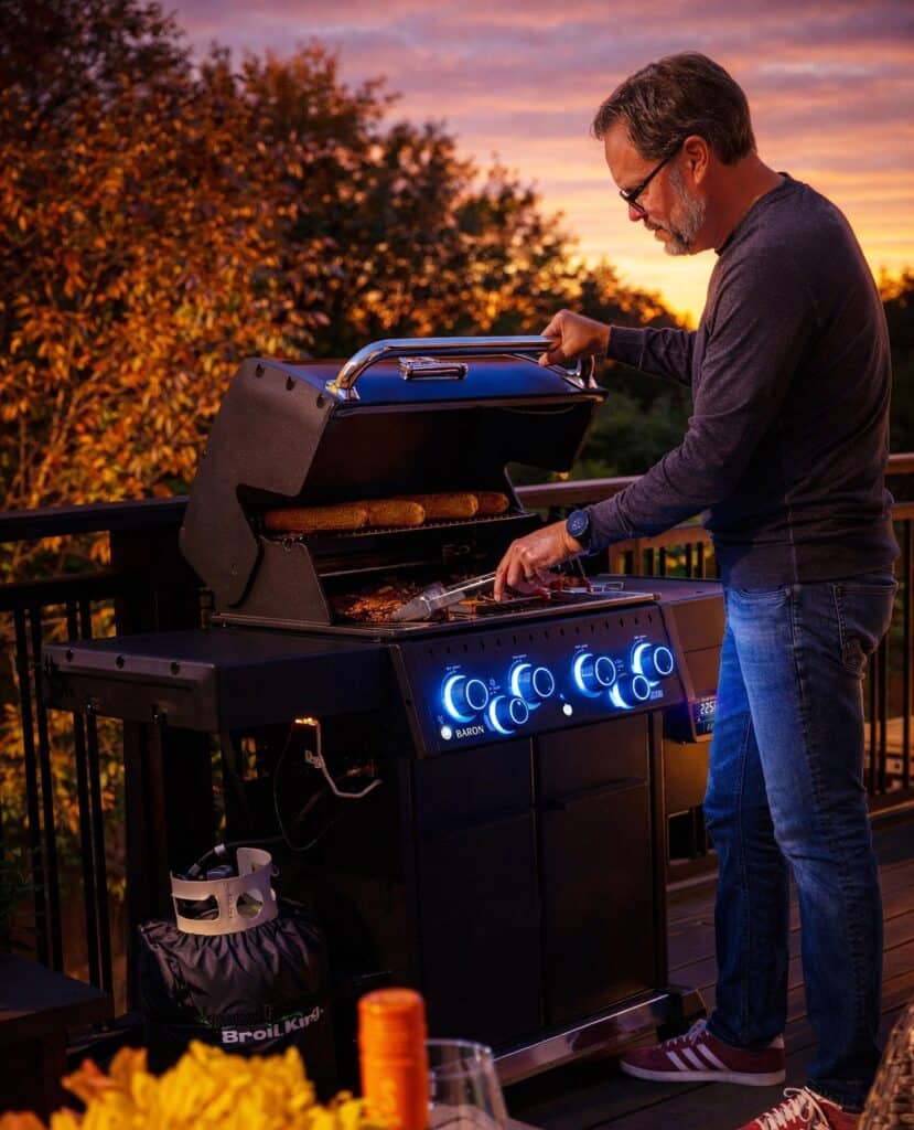 Man Grilling Food In A Broilking Grill