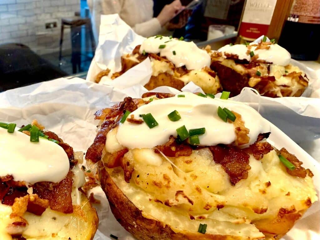 Twice-Baked Smoked Potatoes Served At A Party