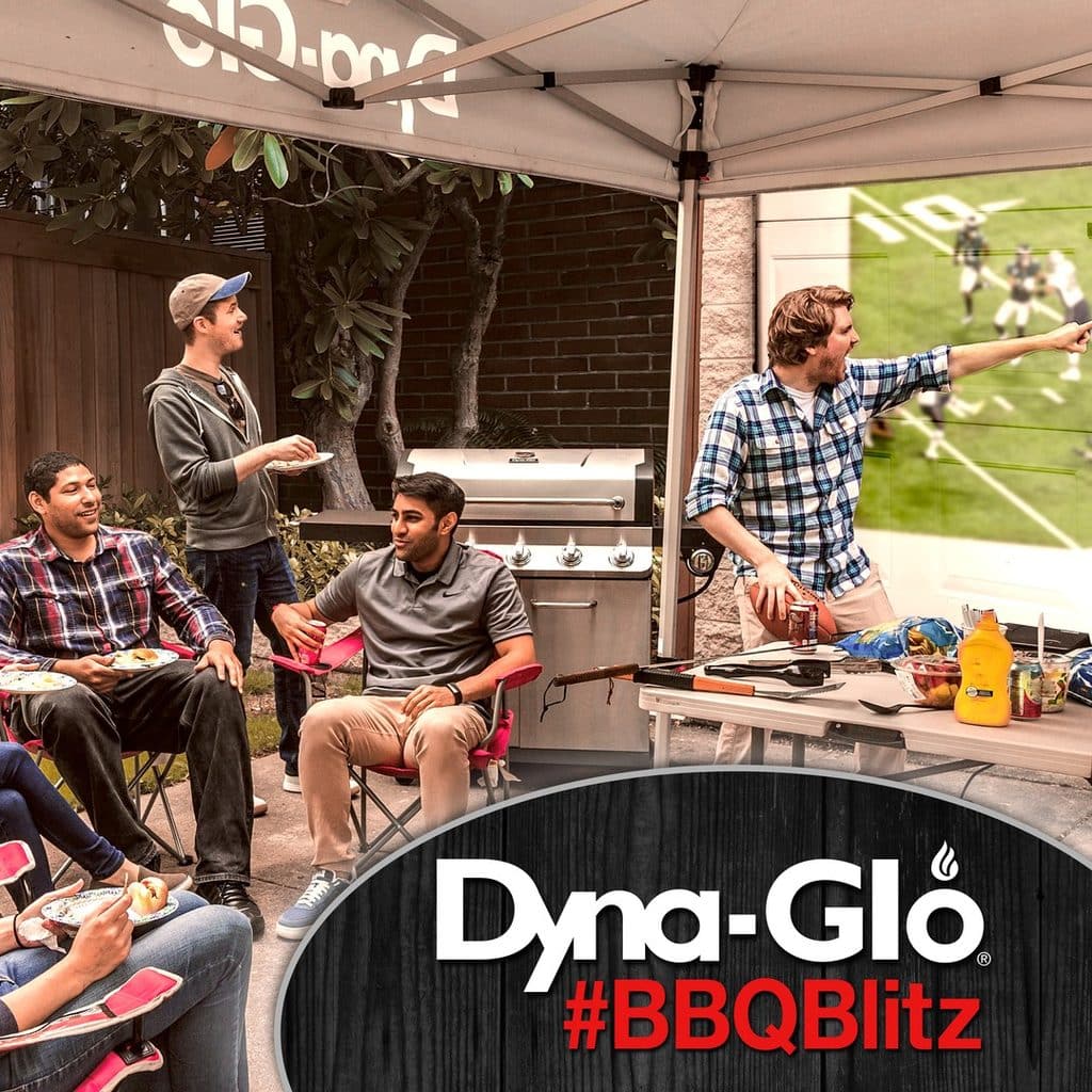 Friends Gather Around A Dynaglo Natural Gas Grill For Bbq Cookout