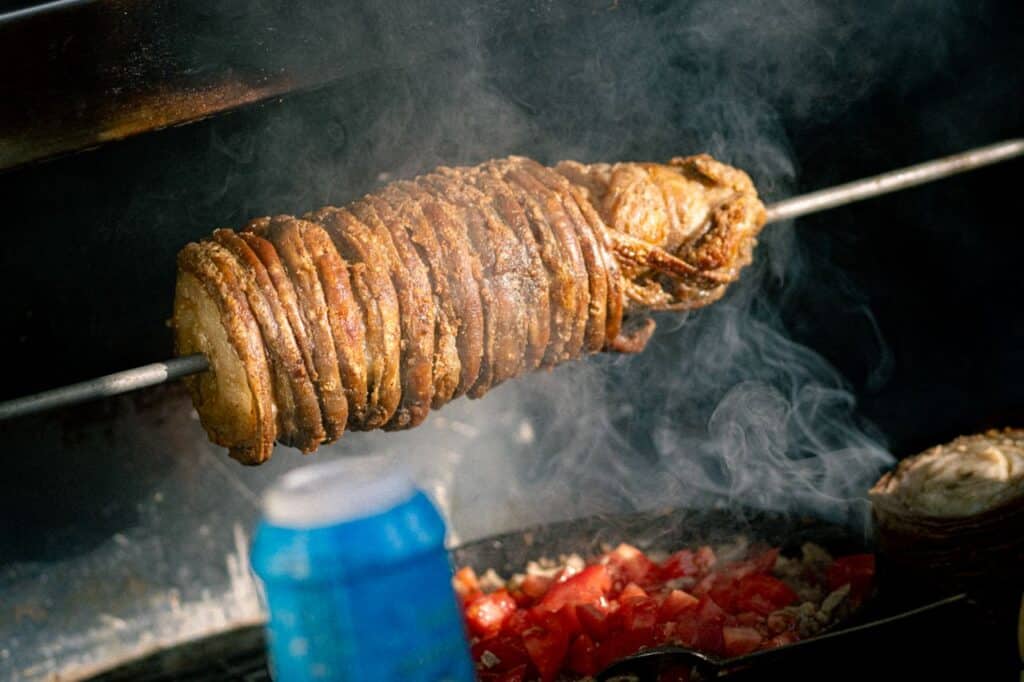 Smoked Leg Of Lamb Paired With A Fresh, Vibrant Gremolata Sauce 1 Smoked Lamb Leg Spit-Roasted