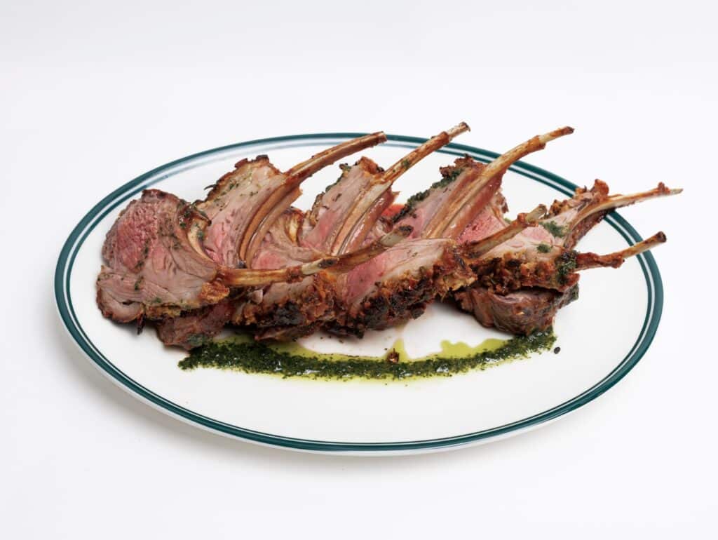 Smoked Leg Of Lamb Paired With A Fresh, Vibrant Gremolata Sauce 3 Special Smoked Leg Lamb On A Platter