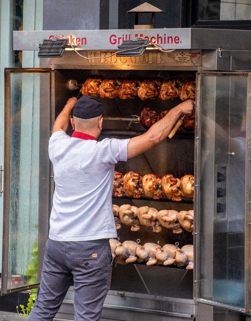 Spitted Duck Over Charcoal In Rotisserie 