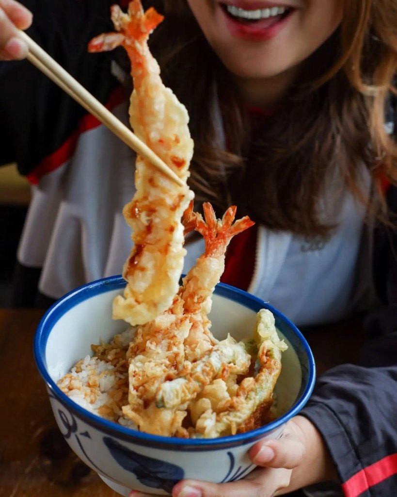 Girl Presenting Tempura On Camera