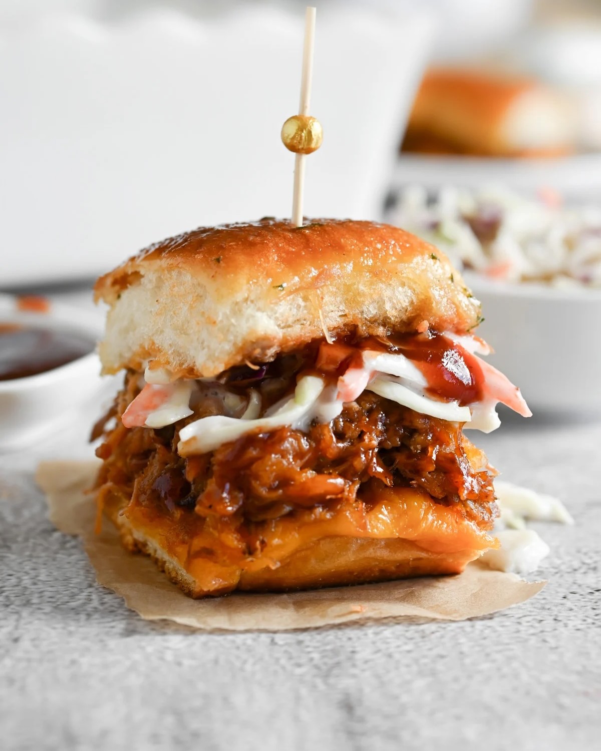 13 College Tailgating Food So Good, Everyone Will Crowd Around The Table 1 Slow-Cooked Pulled Pork Sliders With Tangy Slaw